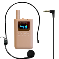 Beige wireless transmitter with microphone on a white background