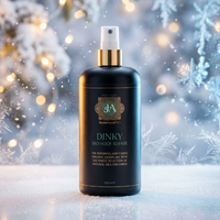 Bottle of Dinky Bio Hair Repair with a festive background