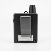 Black electronic device with a metallic panel on a white background