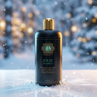 Jolie shampoo bottle with gold cap on a snowy background